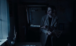 Image of women in dark house